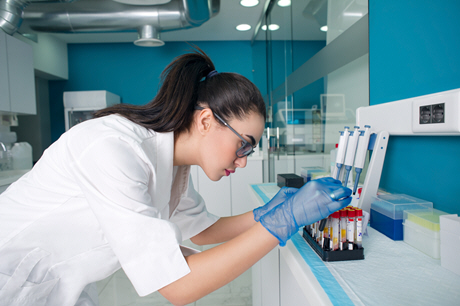 female doctor diagnosing a blood test in lab