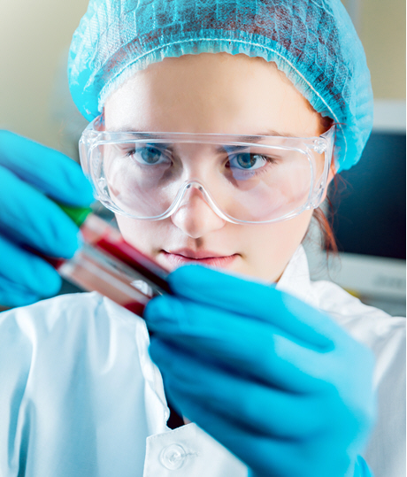 female doctor examines blood test