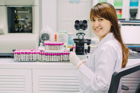 female doctor holds blood sample