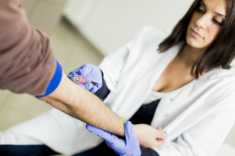 female doctor performs blood sampling