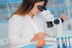 Sermorelin researcher checking fruit and vegetables for harmful elements laboratory for inspection of food quality  300x200